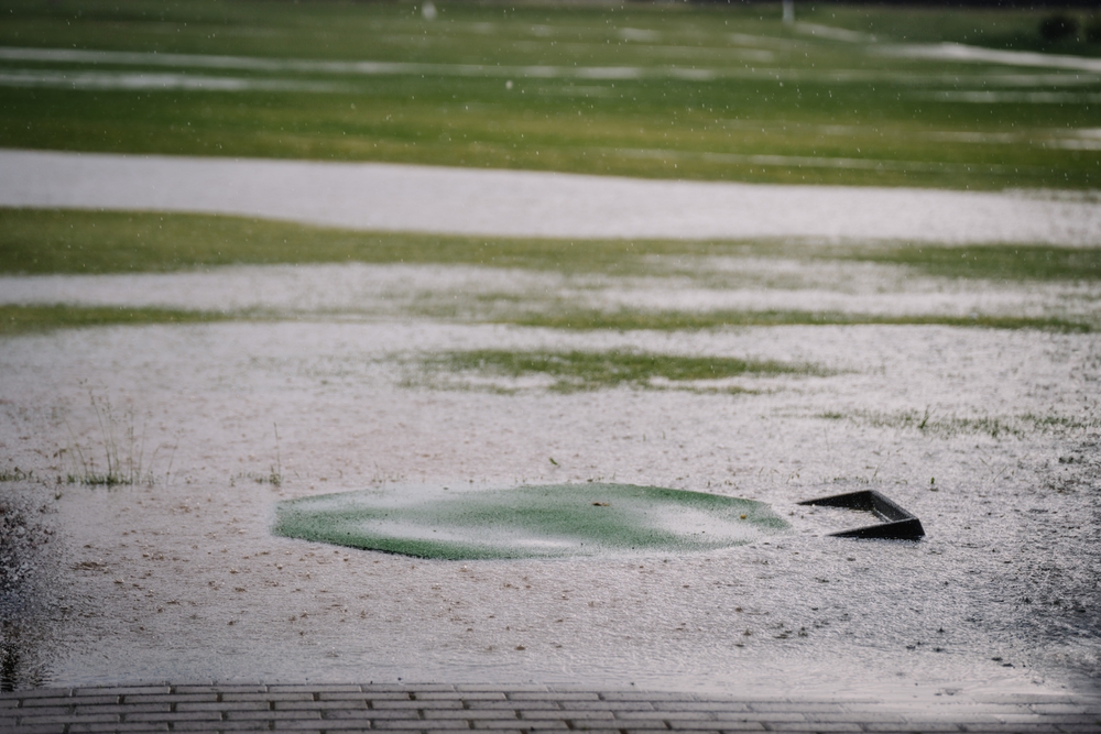 Heavy rain causing a large puddle on a golf course