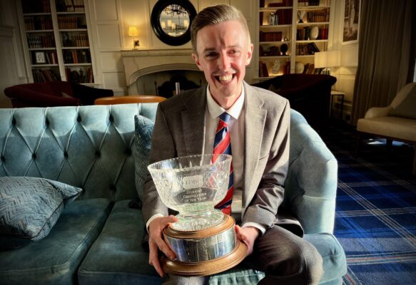 2023 SGOTY winner Michael Russell holding the trophy.