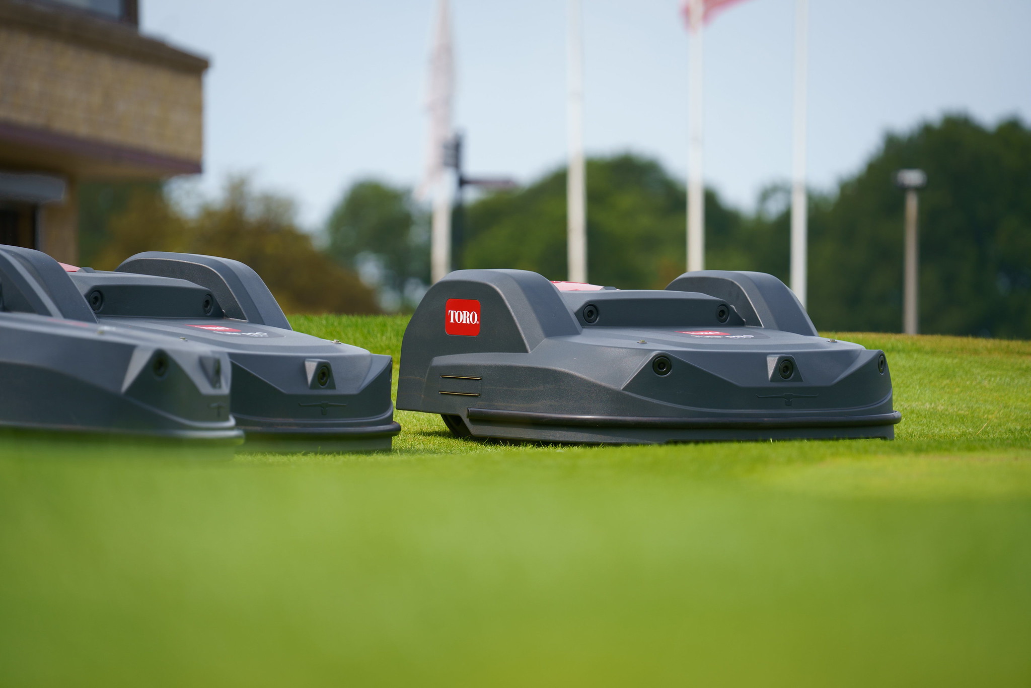Two Toro Turf Pro robotic mowers