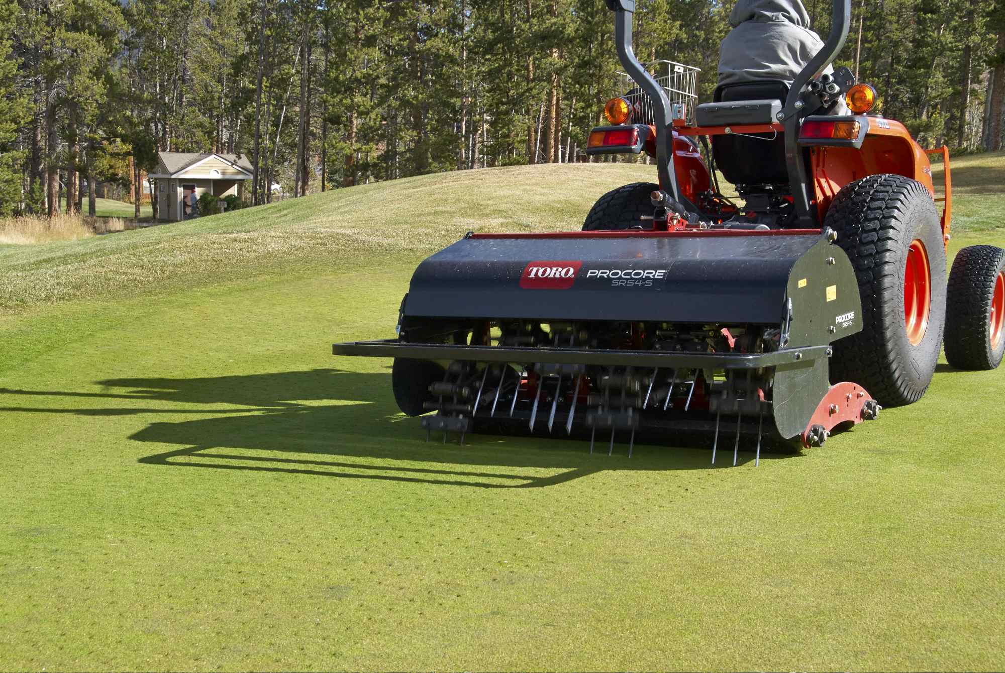Toro ProCore SR54-S aerator in operation on golf course green, delivering deep tine aeration for professional turfcare.