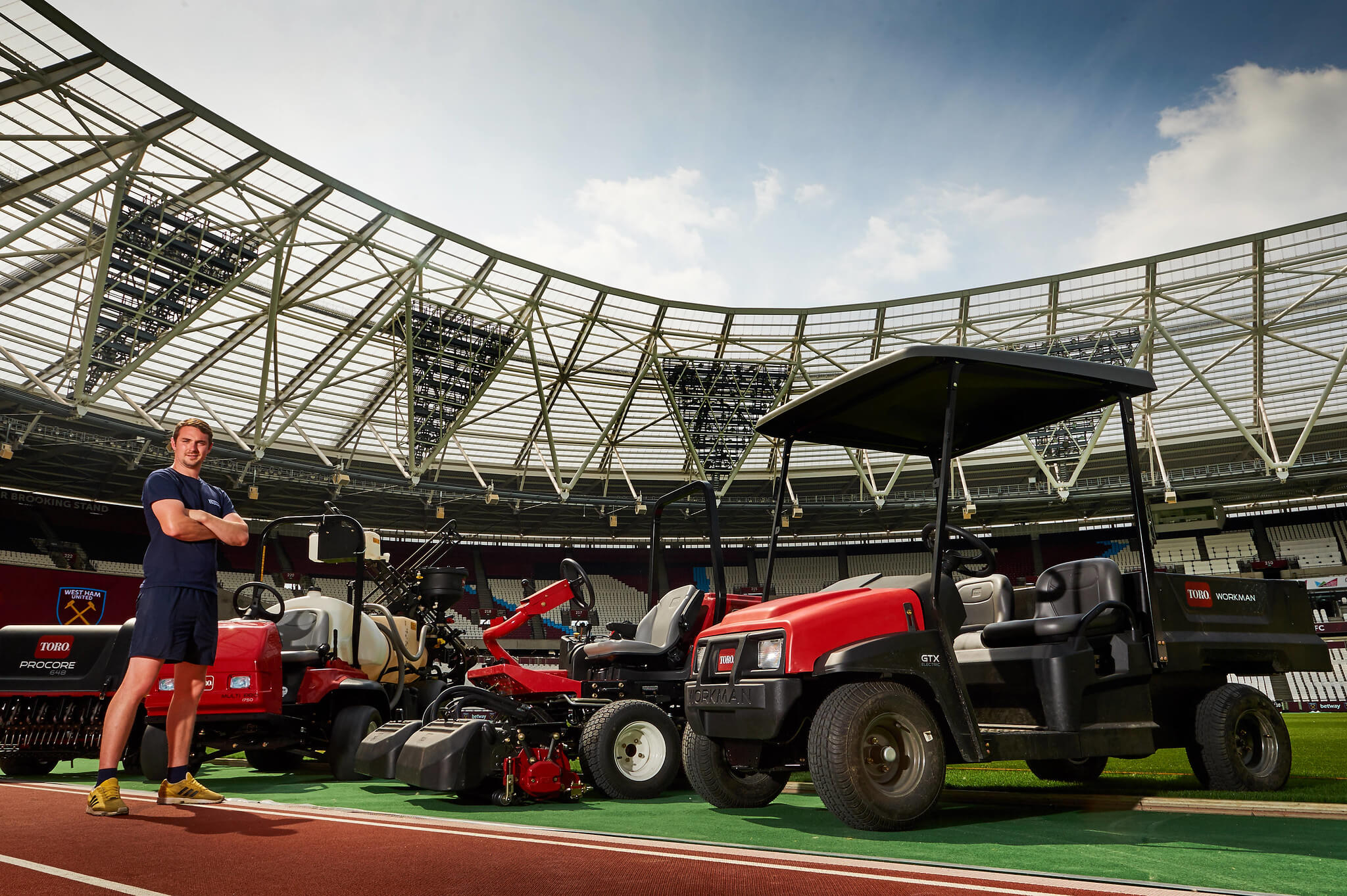 Groundsman at London Stadium with fleet of machinery