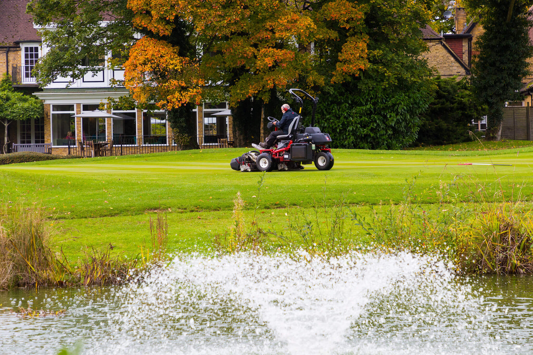Toro mower at Badgemore Park Golf Club with water fountain in the foreground