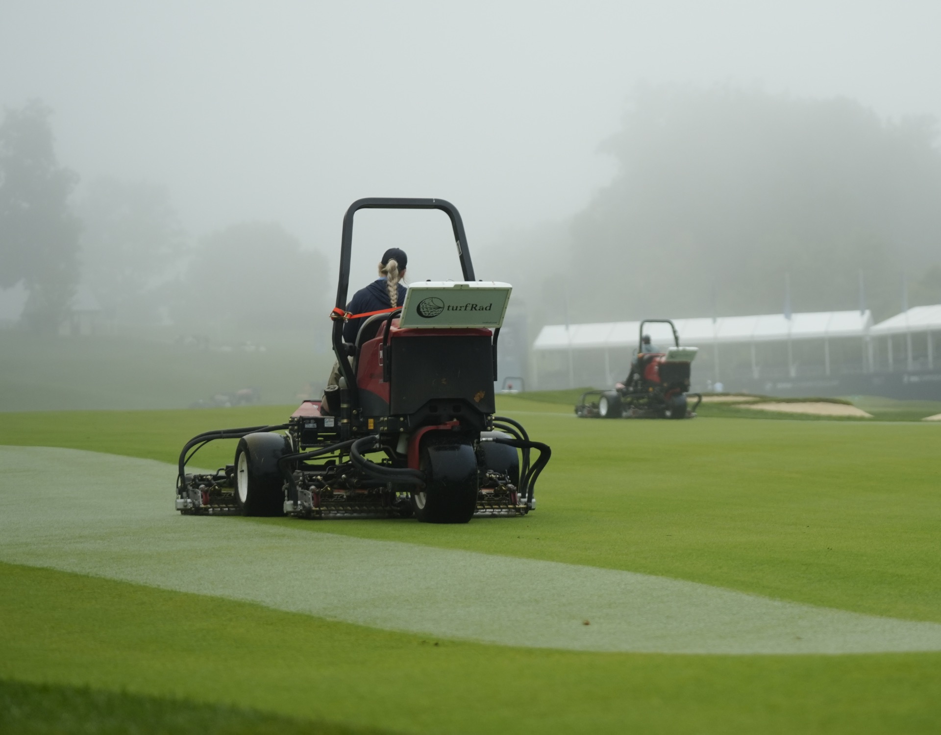 Two Toro ride-on mowers being cutting turf, both with a turfRad sensor attached on the rear