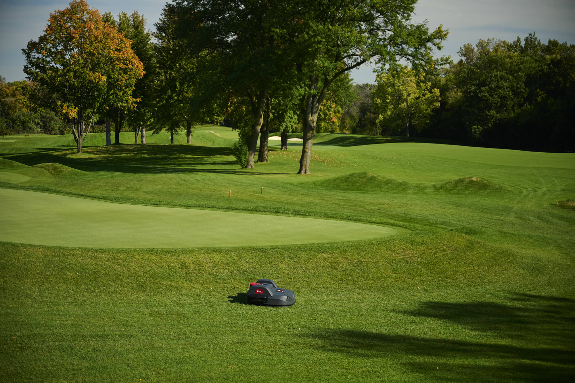 A Toro Turf Pro robot mower on a golf course