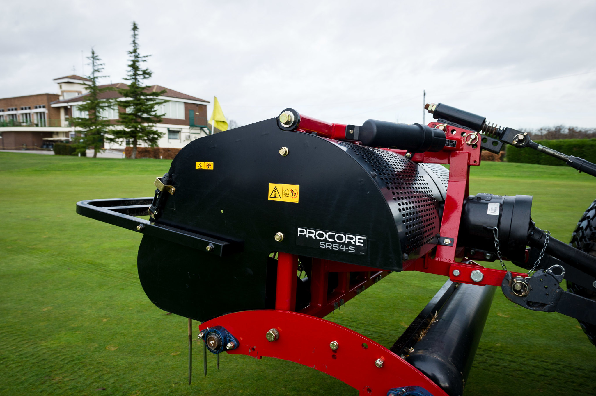 A Toro ProCore 648s aerator mounted on a tractor.