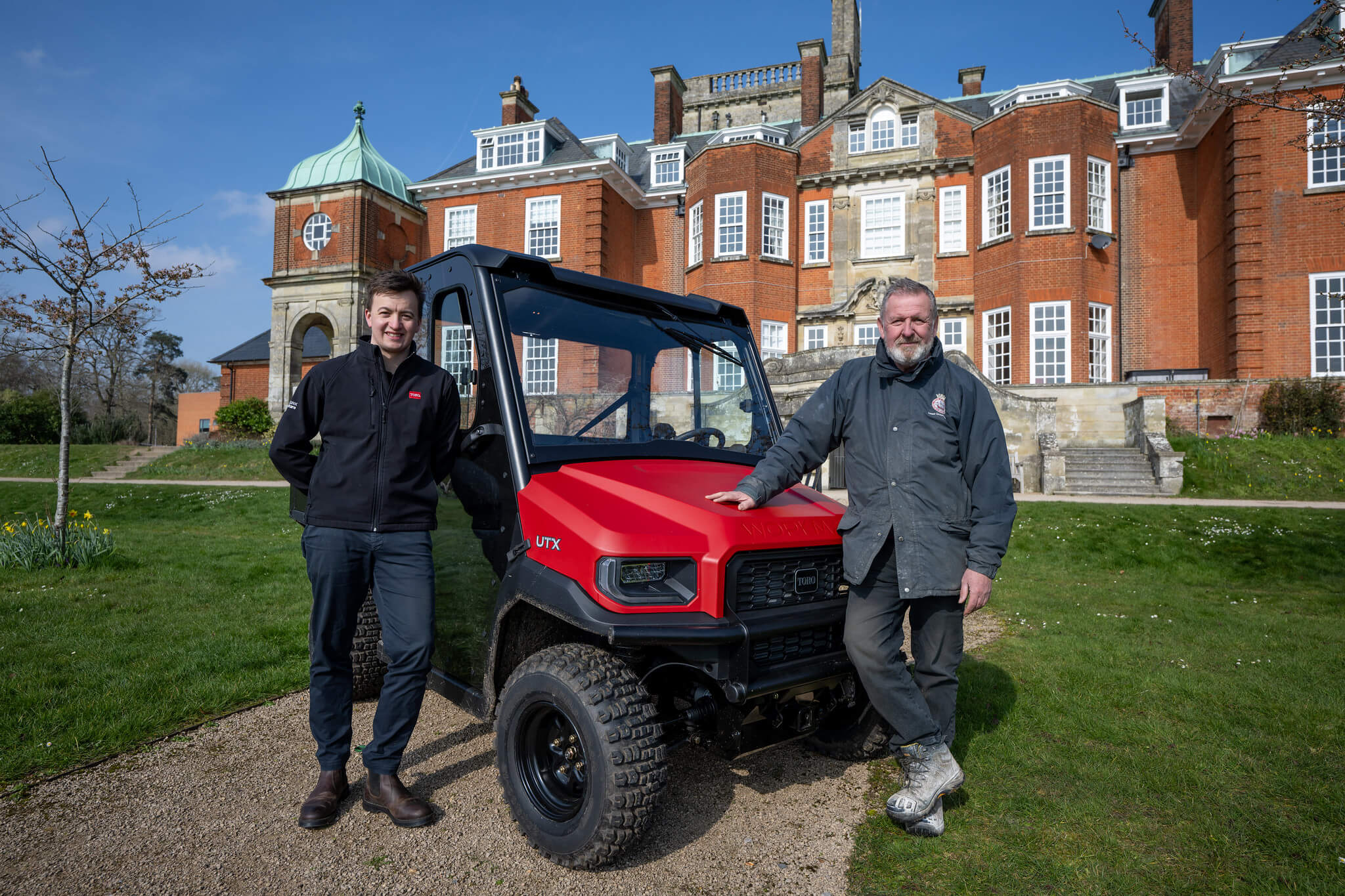 Liam Linehan from Reesink (left) and Ian Osbon, head groundsman at Pangbourne College, stand in front of a Toro Workman.