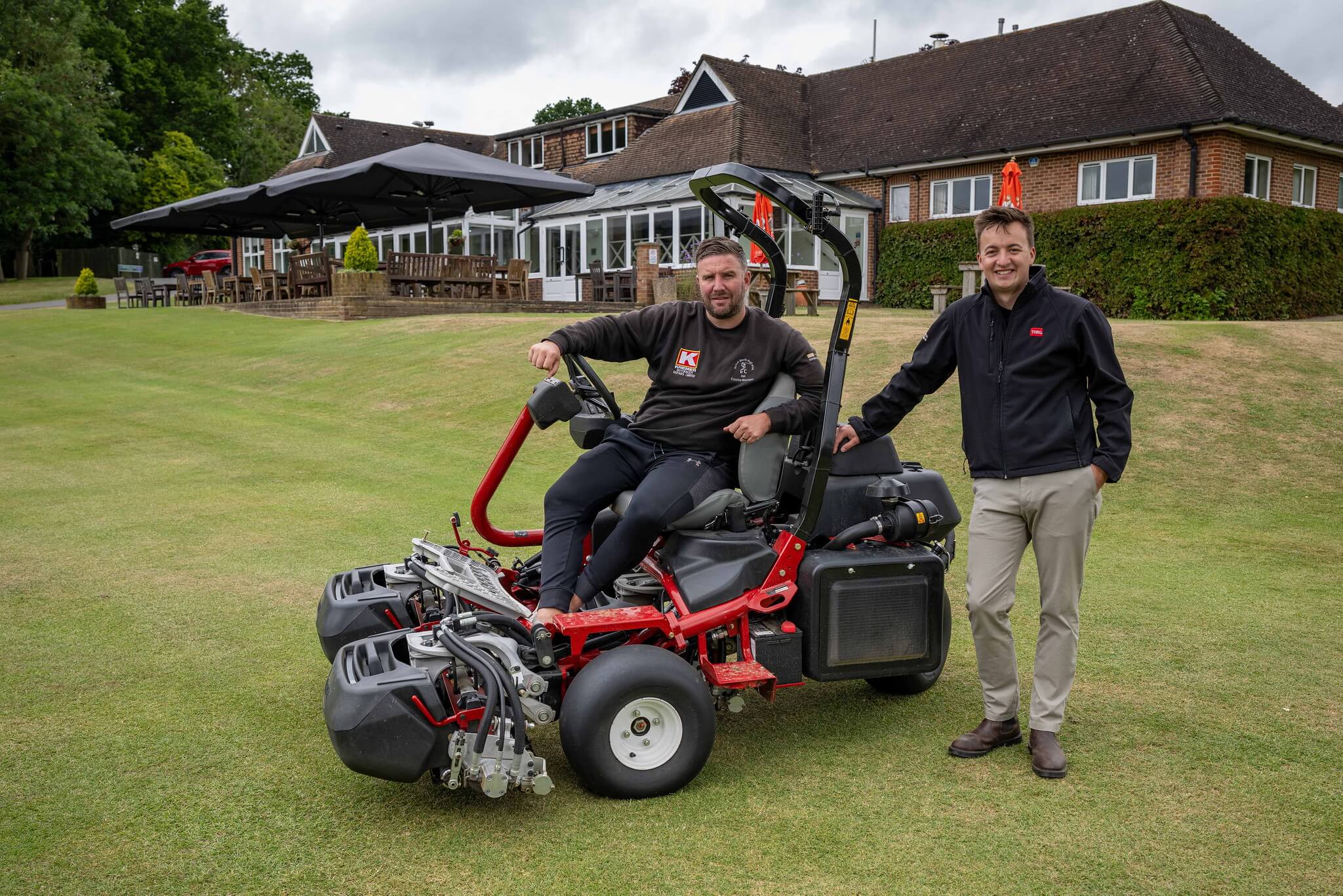 Liam Linehan from Reesink (right) and Calcot Golf Course's head greenkeeper Tom Jennings on a Toro mower.