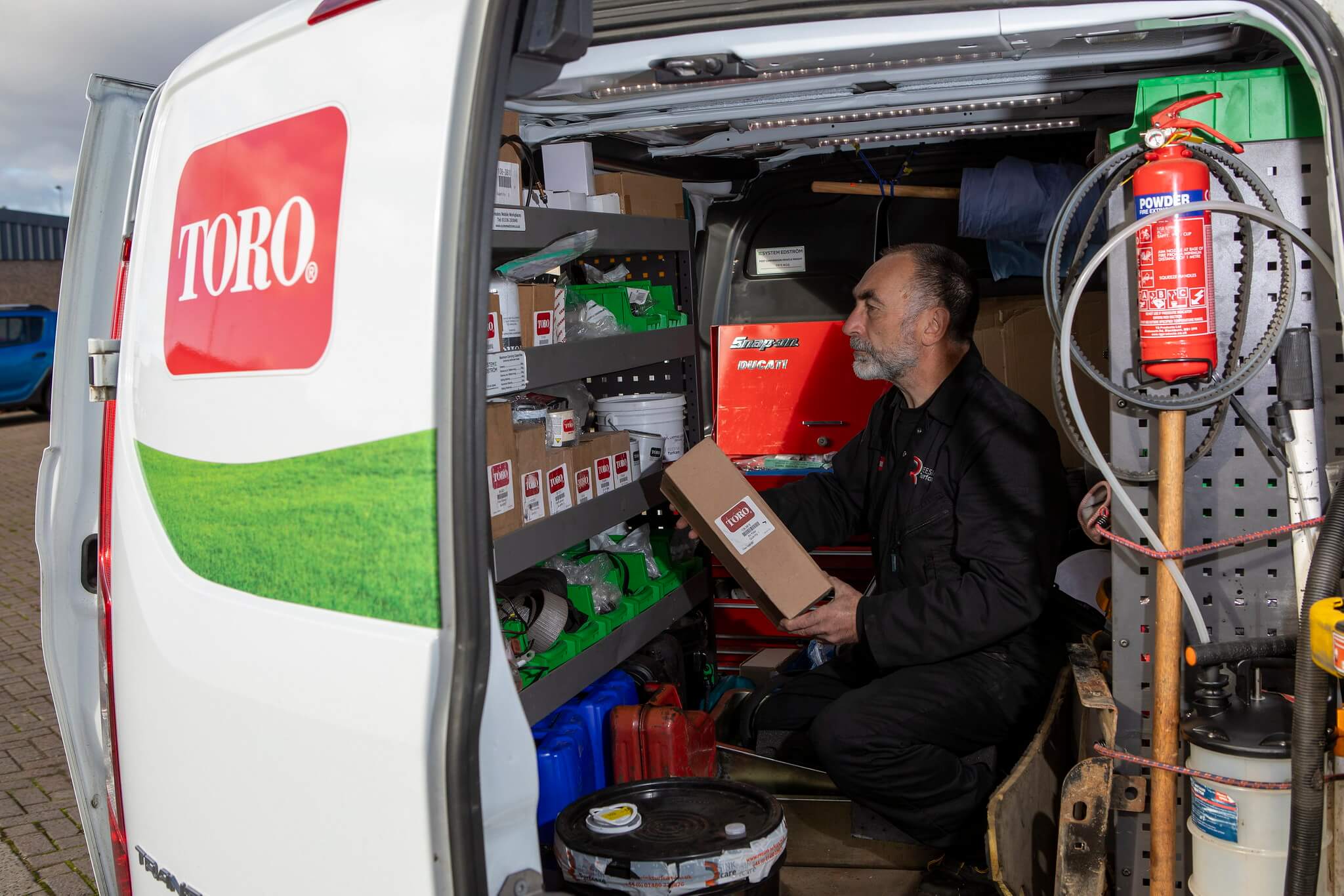 A Reesink dealer in Scotland checking inventory in a Toro van.