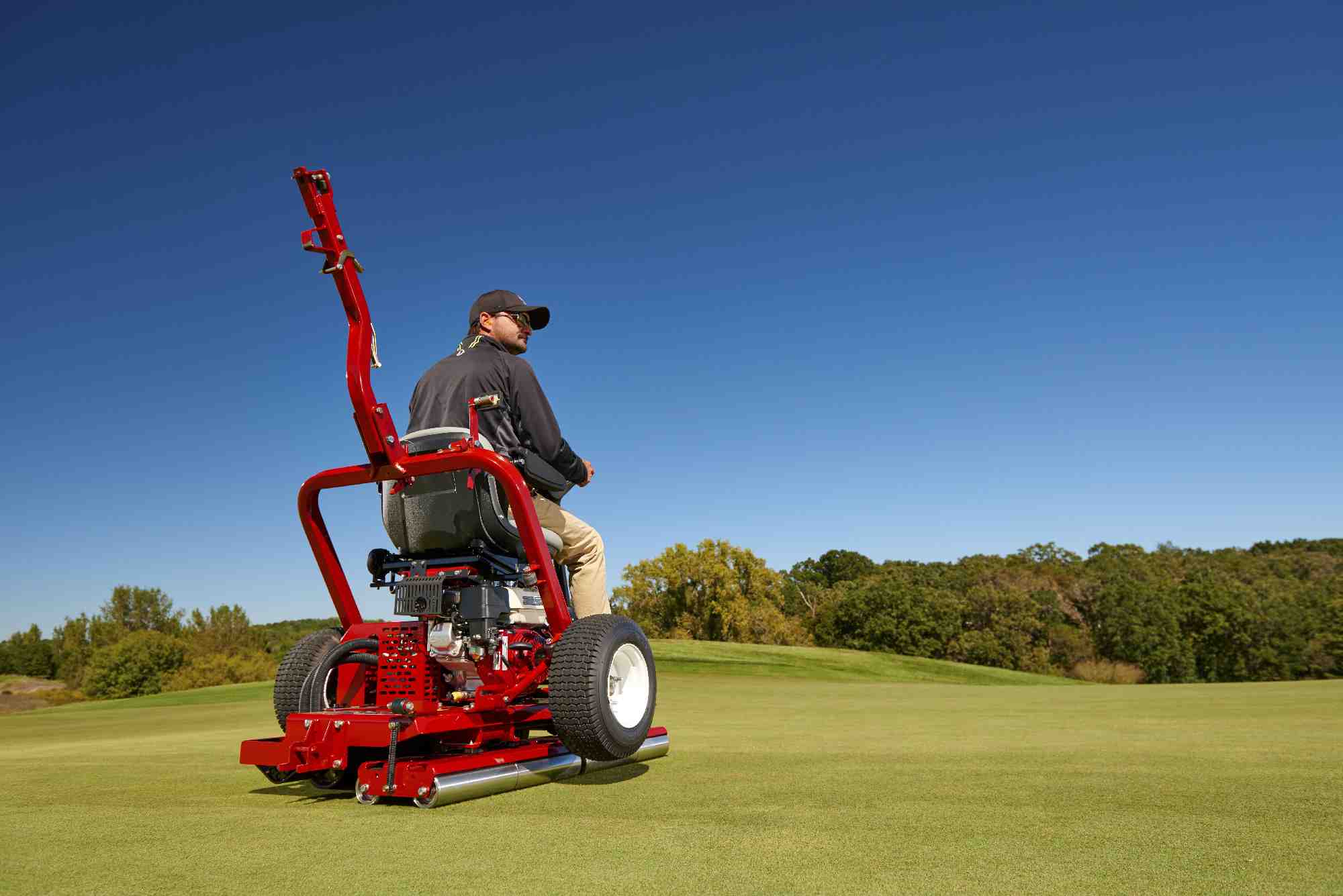 A Toro GreensPro 1260 is used to roll a golf course.