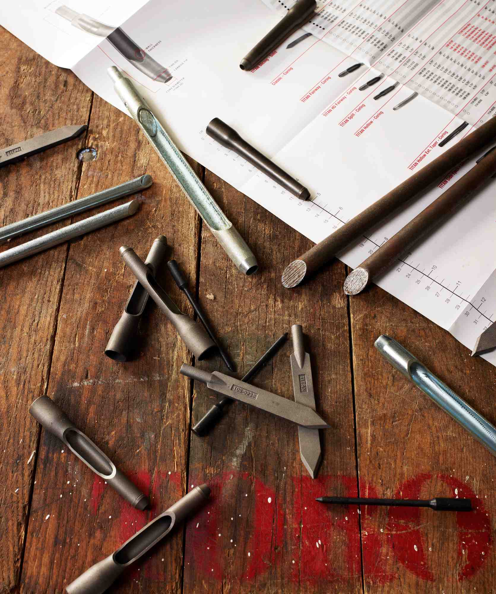 A workbench with Toro tines genuine parts on top.