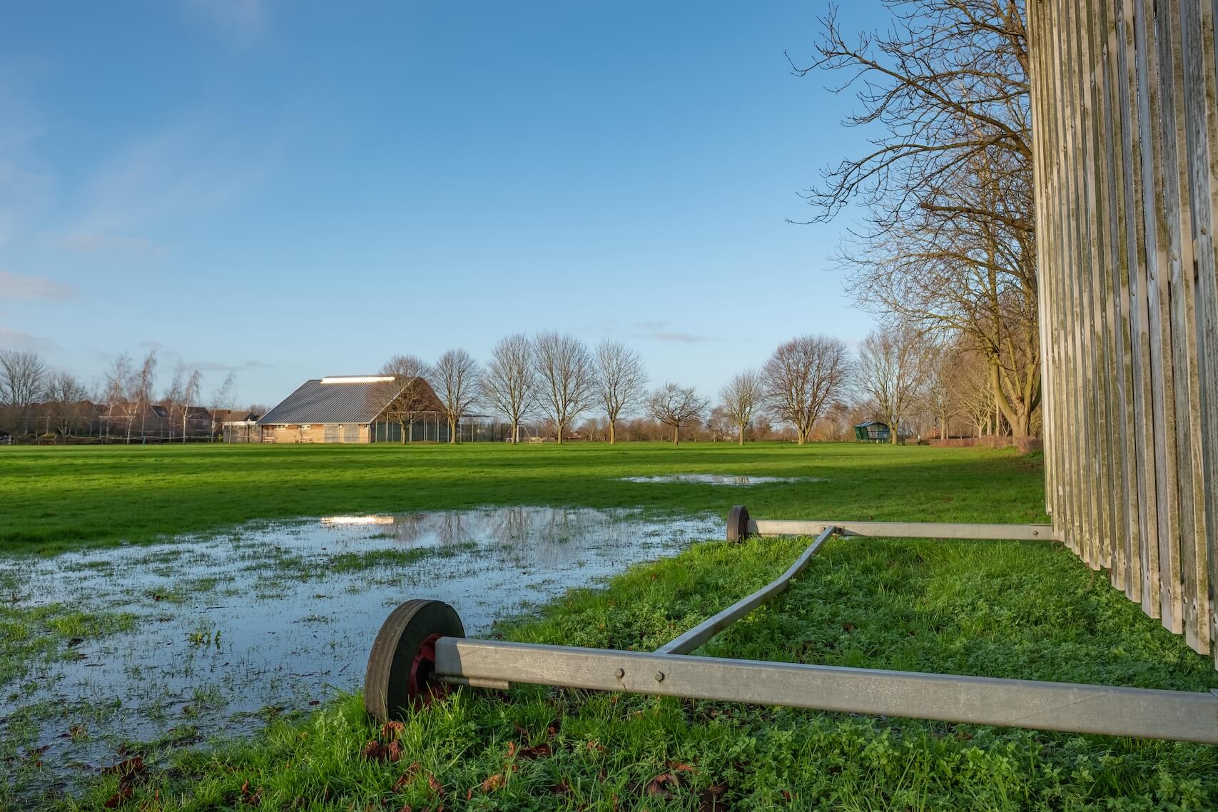 A waterlogged cricket pitch.