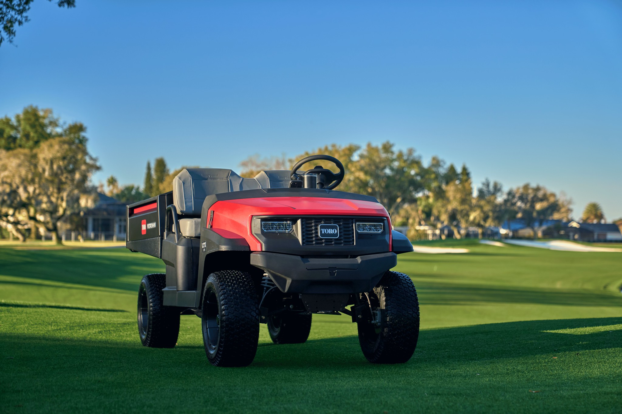 New Toro Workman LTX stationary on a golf course.