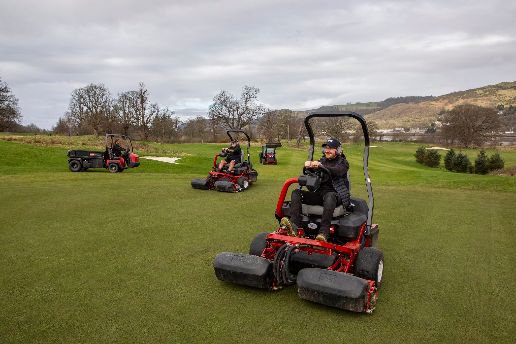 Toro mowers and a Toro utility vehicle on a golf course.