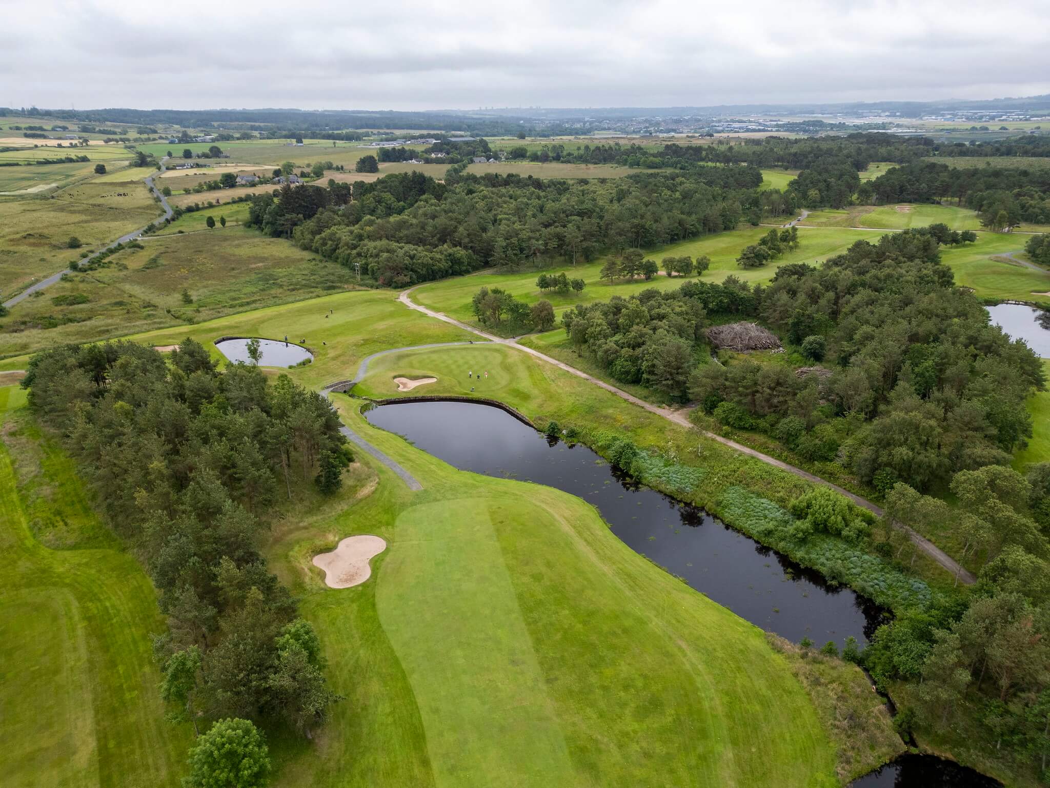 an aerial view of a half and half golf course pattern.