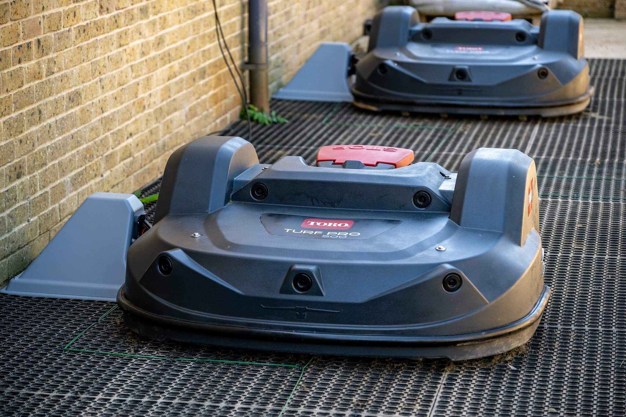 Two Toro Turf Pro 500 mowers self-charging.