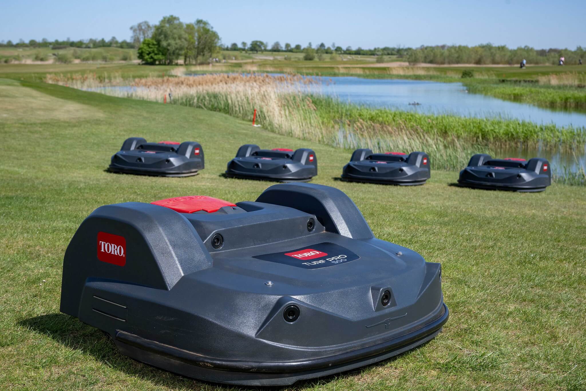 A fleet of Toro Turf Pro 500 mowers on a golf course.