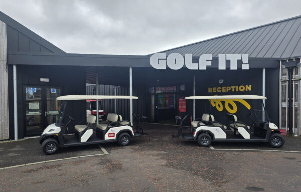 Two Toro Vista passenger vehicles outside Golf It! in Glasgow.