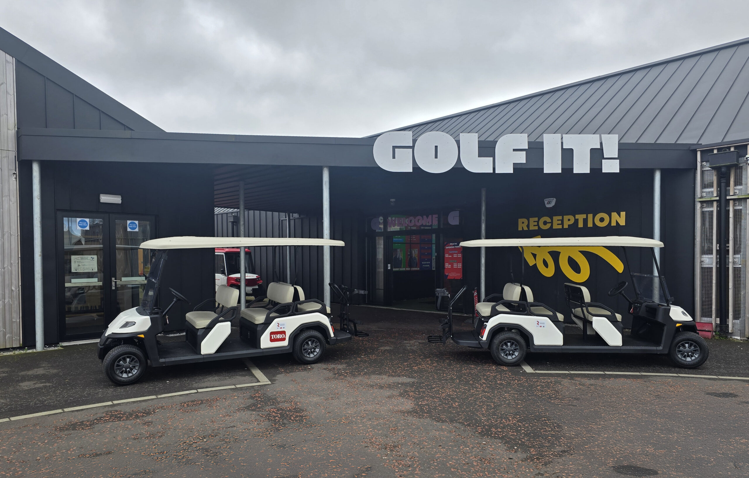 Two Toro Vista passenger vehicles outside Golf It! in Glasgow.