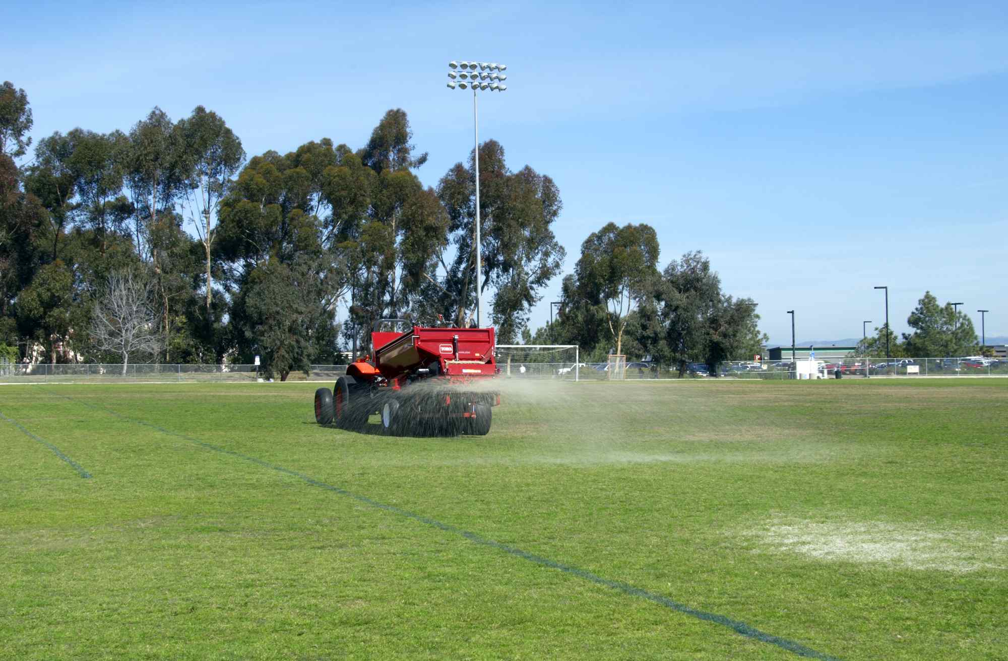 A Toro MH 400 topdresser on a football pitch.
