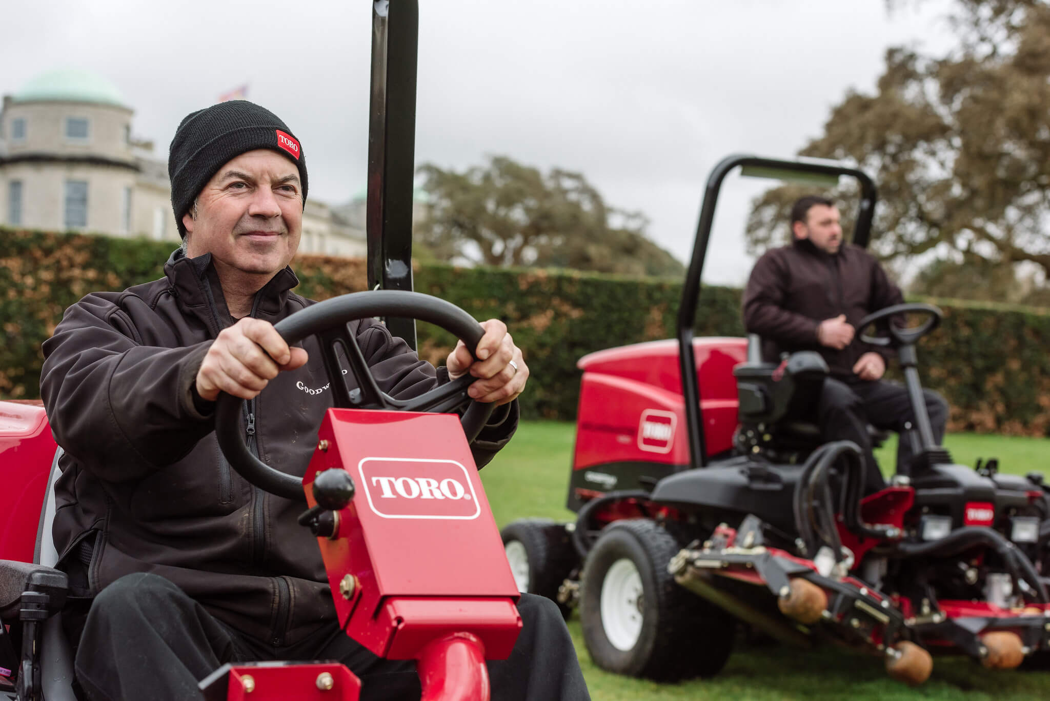 Groundskeepers on Toro ride-on mowers at the Goodwood estate.