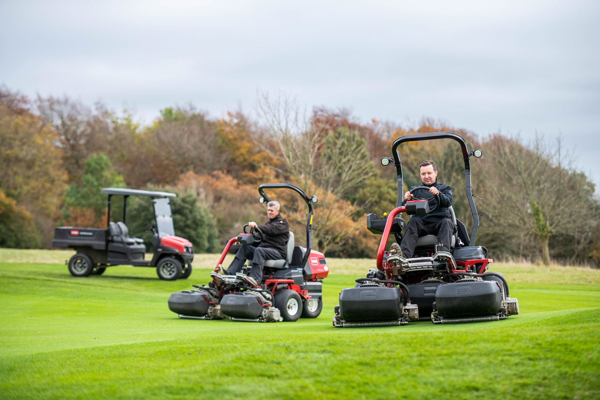 A Toro workman utility vehicle and greensmowers on the course at Goodwood.
