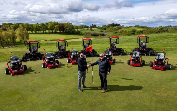 Fife Golf Trust's manager and one Reesink rep stand in front of eleven Toro mowers