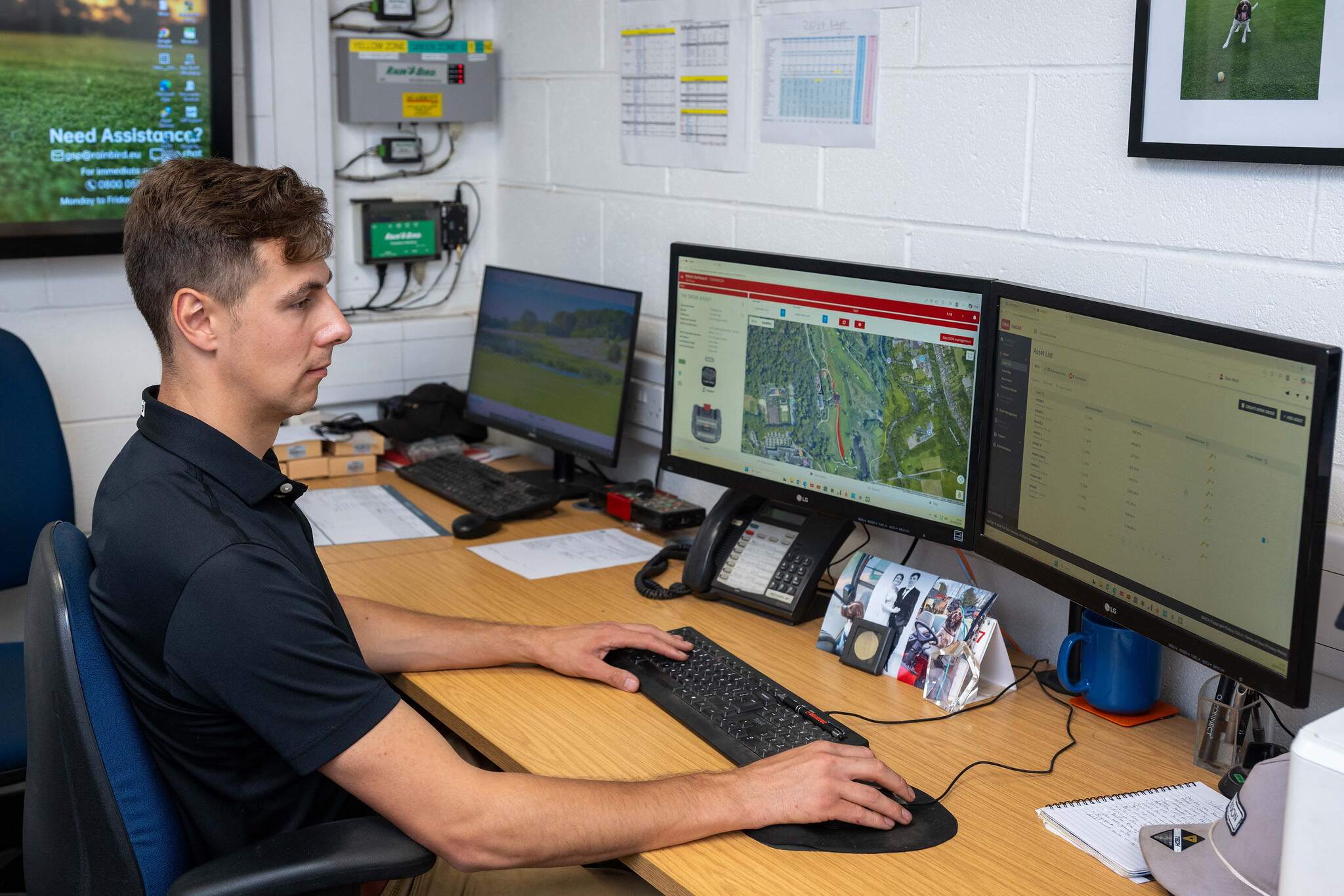 Sam Reid, Golf Course Manager at The Grove on his computer looking at the irrigation information from TurfRad