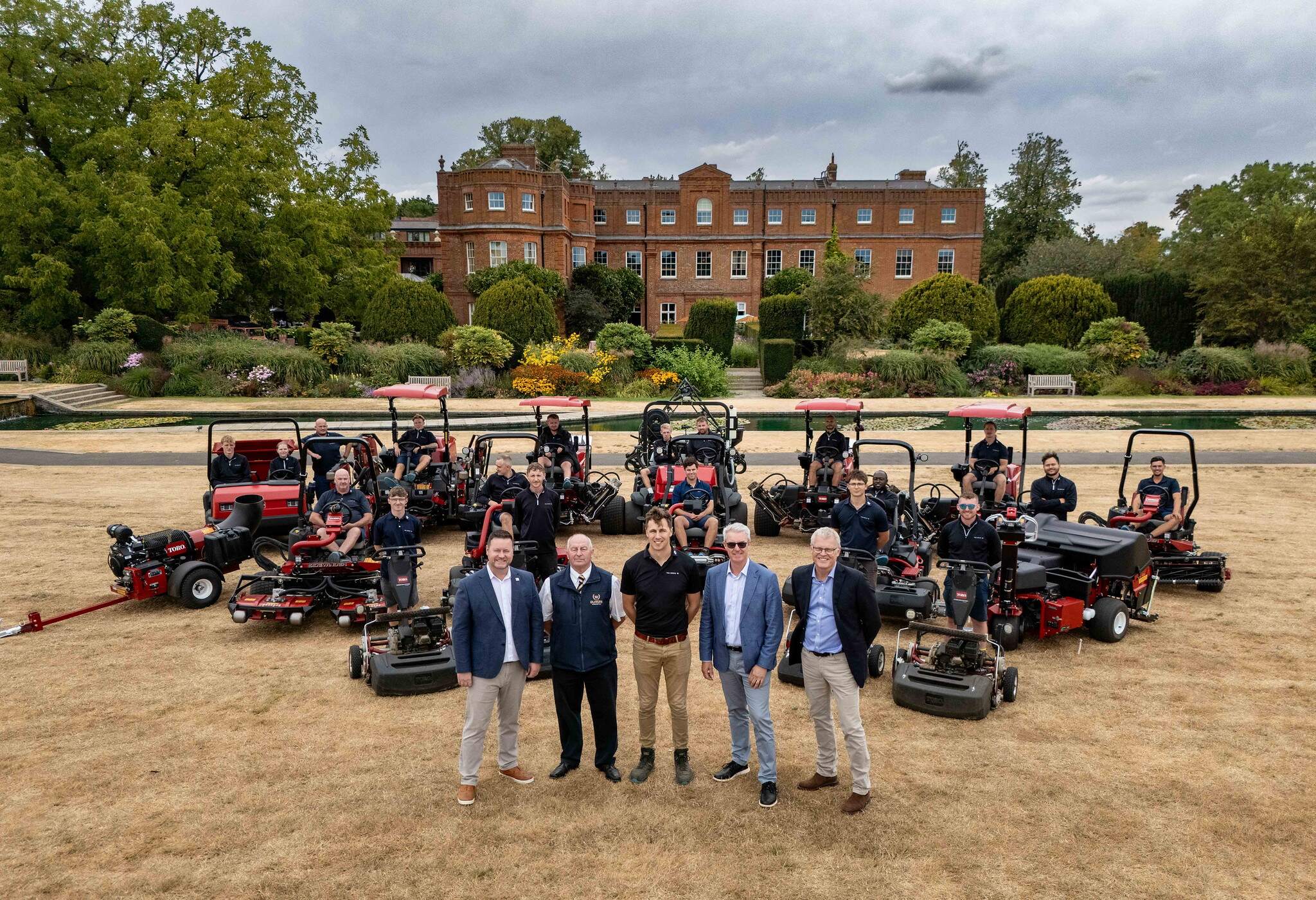 Darren Anderson, Reesink Turfcare; Glen Giddings, Oliver Landpower; Sam Reid, The Grove; Andrew Brown and Simon Squires, both from The Toro Company; and the greenkeeping team with some of the new Toro fleet.