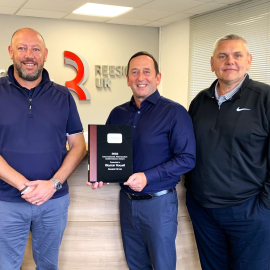 From left: John Mooney, commercial products area Manager – UK, Ireland and Middle East at The Toro Company presents Reesink UK’s managing director Alastair Rowell and operations manager David Jackman, with the Toro 2022 International Aftermarket Achieveme