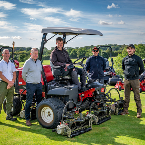 Course manager Tom Cook (centre) on new Toro Reelmaster 5010-H pictured with Reesink Turfcare’s Richard Freeman (centre-left) and the Toot Hill Golf Club greenkeeping team.