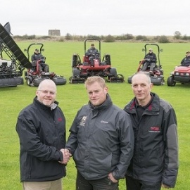 Head greenkeeperGlenn Rayfield, centre, with Lely’s Julian Copping, left, and Andy Branton of TNS Group.