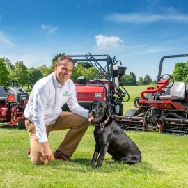 Simon Fitton, managing director of Nene Golf Ltd, with Toro the dog and latest Toro machines.