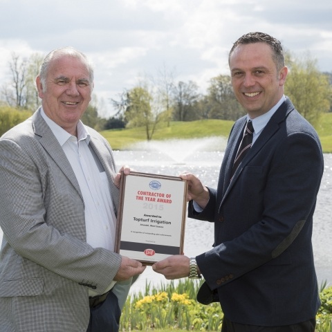 Colin Clark, managing director of Topturf Irrigation, on the left, collects his award from Lely Turfcare’s Robert Jackson.