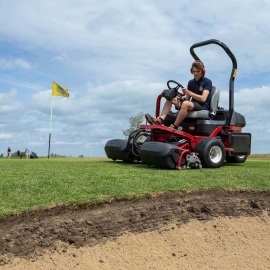 The Toro Greensmaster 3250-D in action.