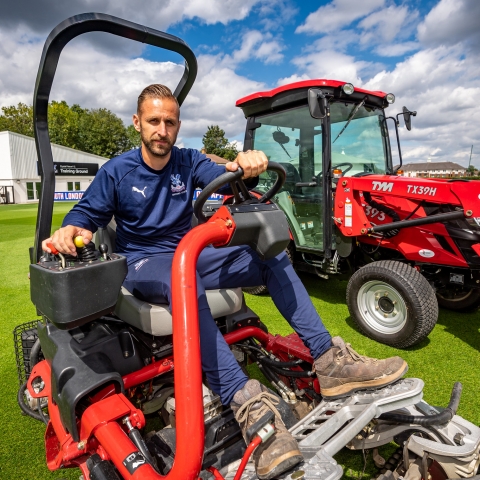 Assistant head groundsman Dean Waters with the Toro fleet at Crystal Palace Training Ground.